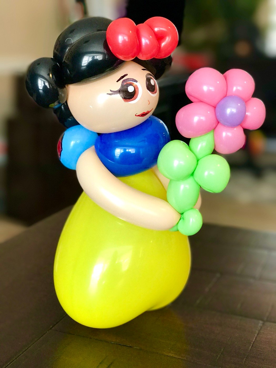 Princess balloon sculpture with flower